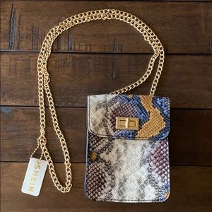 Twist lock chain snakeskin mini bag